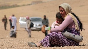 Real victims of western policy. and Isil violence: Christian woman and child made homeless.